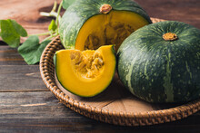 Green Pumpkin In Basket On Wooden Background, Organic Vegetable In Autumn Season