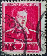 Wall Mural - ROMANIA - CIRCA 1940: a postage stamp from Romania , showing a portrait of Michael I of Romania (1921-2017) in military uniform. Circa 1940