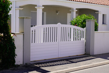 Wall Mural - high classic modern white pvc plastic home gate portal of suburbs house street city