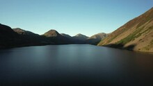 Evening Light At Wast Water In The Lake District National Park. Northern England Lakes And Mountains. 4K Drone Footage Flying Along Big Lake.