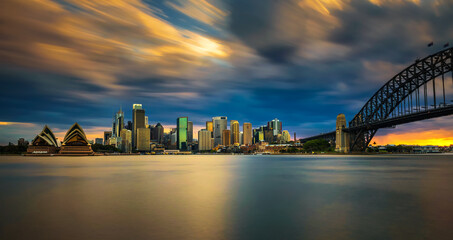 Fototapete - Sunset skyline of Sydney downtown with Harbour Bridge