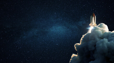 Fototapete - New space shuttle rocket with smoke and blastoff successfully lift off into stellar outer space. Space wallpaper and free copy space for design and text