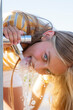 © ADDICTIVE STOCK - Girl drinking water from tap on street
