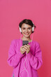 Leinwandbild Motiv White young woman listening music with headphones and cellphone