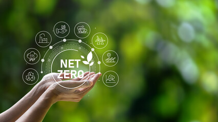 The concept of carbon neutral and net zero. natural environment A climate-neutral long-term strategy greenhouse gas emissions targets with green net center icon on hand cap and green background