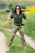 © Chmutphoto - Soldier woman in military uniform. A girl in a military uniform with a weapon