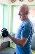 © Solid photos - Senior man exercise at home