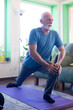 © Solid photos - Senior man exercise at home
