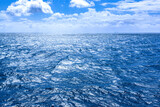 Fototapeta Na sufit - Cloudscape over choppy seas in the North Sea off the coast of Denmark