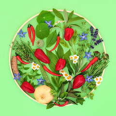 Sticker - Edible flowers herbs and spice health food seasoning abstract design. Healthy natural summer ingredients for culinary use on green with circular wooden frame. 