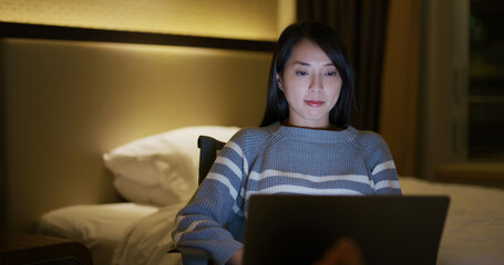 Wall Mural - Woman work on computer at night