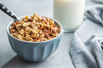 Wall Mural - Breakfast cereal flakes in bowl.