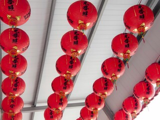 Sticker - Lantern in a temple in Taiwan, with the words Buddha's light, shines on it