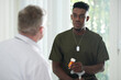© DragonImages - Military man with tired red eyes talking to general pracitioner about new medicine he recommended