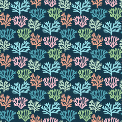  Pastel colored coral reefs seamless pattern vector. Hand-drawn cartoon undersea corals surface design on dark background. Tropical wild life hard corals by orange, pink, green and blue colors