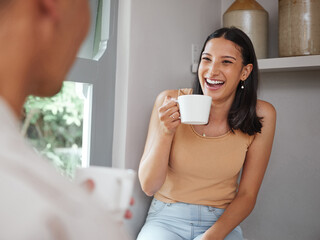 Sticker - Happy, carefree and laughing woman drinking coffee in the morning and having fun with her boyfriend at home. Young and excited female laughs at a funny joke while and enjoying time with her partner