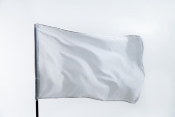 White flag waving on white background