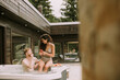 © BGStock72 - Young couple enjoying in outdoor hot tub on vacation