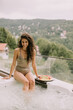 © BGStock72 - Young woman enjoying in outdoor hot tub on vacation