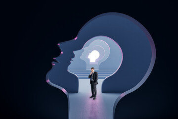 Side view of thoughtful young european man standing inside abstract human head outline tunnel, Brainstorm and creativity concept.