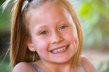 Close Up Of Smiling Young Girl With Dimples