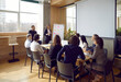 © Studio Romantic - Business meeting people employees of modern corporation in conference room with watching presentation plans of manager or CEO for development of company sits at table in spacious office