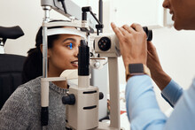 Eye Test, Exam Or Screening With An Ophthalmoscope And An Optometrist Or Optician In The Optometry Industry. Young Woman Getting Her Eyes Tested For Prescription Glasses Or Contact Lenses For Vision
