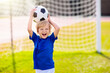 © famveldman - Kids play football. Child at soccer field.