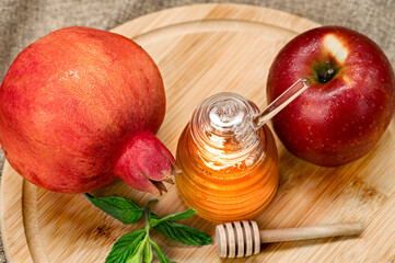 Wall Mural - Rosh Hashanah. Pomegranate, apple and honey, traditional food for Jewish New Year celebration, Rosh Hashanah. View from above.