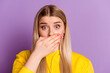 © Tetiana - Photo of young girl cover mouth hand oops problem tell secret information isolated over violet color background