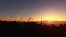 Aerial Flight At Sunset Over Several Wind Turbines Of Renewable Energy Wind Farms In Santa Ana. Costa Rica