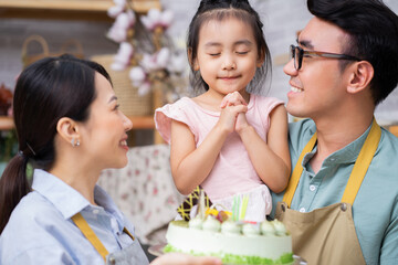 Wall Mural - Young Asian family, birthday party