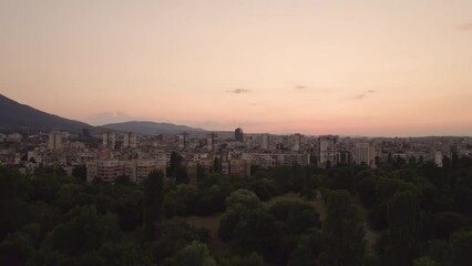 Wall Mural - side Flying near tree tops sofia sunset sky aerial view