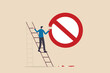 Prohibition or stop sign, forbidden, unlawful or not allow to do, attention and warning sign, banned or illegal concept, businessman climb up ladder to paint prohibition symbol on the wall.