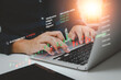 © khunkornStudio - Business using computer laptop and analysing the financial data graph diagram interface virtual screen technical price indicator trading online concept.