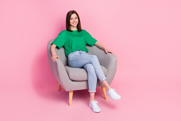 Wall Mural - Full size portrait of gorgeous satisfied girl sitting comfy chair toothy smile isolated on pink color background