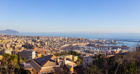  Panoramic view of Genoa in a sunny day with the causeway and the buidings of the historic center, Italy