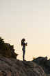 © uv_group - Young woman practice yoga and meditation near the sea at sunrise, healthy lifestyle concept