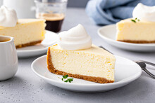 Classic New York Cheesecake With A Dollop Of Whipped Cream