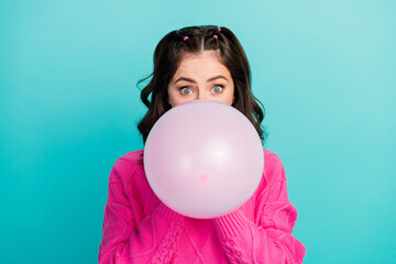 Wall Mural - Closeup photo of young beautiful lady attractive prepare birthday cap head hide half face big balloon blowing air isolated on cyan color background