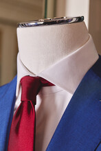 Mannequin In White Shirt, Blue Suit And Red Tie, Close-up. Custom Expensive Tailored Suit On Mannequin