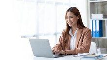 Asian Woman Working With Laptop In Her Office. Business Financial Concept.