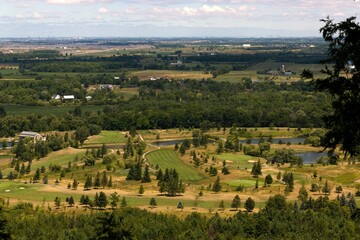 Wall Mural - View of Milton, Ontario with landscaped pond, green grass meadows, from Mount Nemo Conservation Area