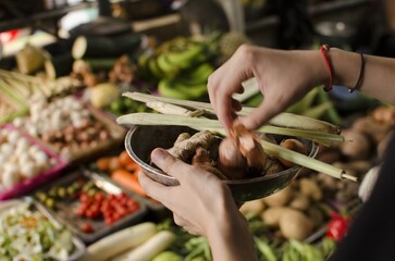 Buying fresh food and vegetables on vietnamese street market in Hanoi