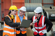 © eakgrungenerd - Three man industrial engineers wear hard hats and uniform using laptop talking project of factory inside heavy industry manufacturing. Supervisor teaching work to employee.