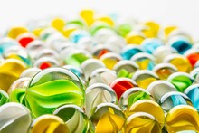 Closeup Shot Of A Pile Of Colorful Marble Balls In A White Background