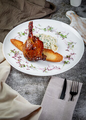 Canvas Print - Smoked roasted rabbit leg. Served with mousse Three cheese, crusty bread with herbs, roasted zucchini