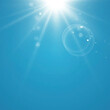 Clear blue sky with sun shine. Lens flare effect. EPS 10 vector