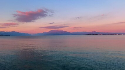 Wall Mural - Rippled surface of Lake Garda on sunset, Desenzano del Garda, Italy