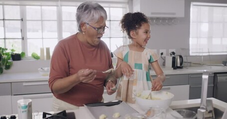 Canvas Print - Young child laughing and playing with her grandparents while learning, baking or cooking. A little girl, grandfather and grandmother bonding, having fun and spending quality time together.